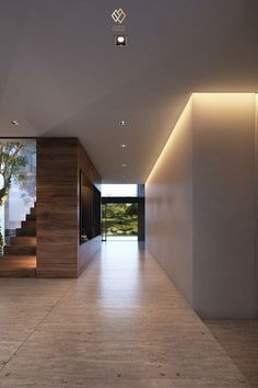 an empty hallway with stairs leading to the outside