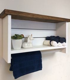 a shelf with towels and other items on it