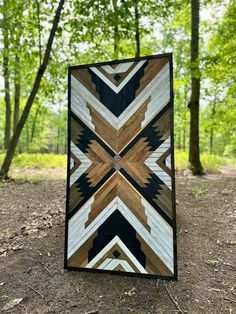 a quilt made out of wood in the woods