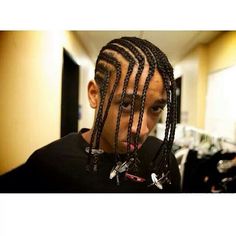 a young man with dreadlocks on his head