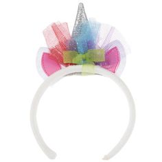 a white headband with multicolored bows and a unicorn's horn on top