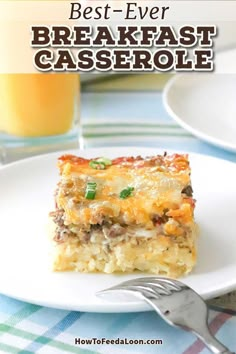 the best ever breakfast casserole on a plate with a fork and glass of orange juice