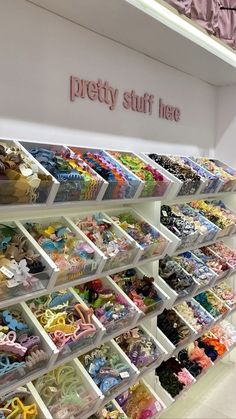 the shelves are filled with many different types of dolls and accessories for sale at pretty stuff here