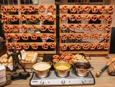 a table topped with lots of pretzels and other foods