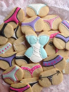 decorated cookies are arranged in the shape of bikinis