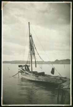 an old photo of a sailboat in the water