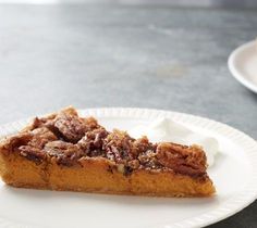 a slice of pecan pie on a white plate