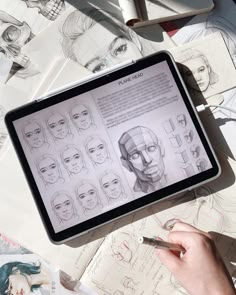 a person is drawing faces on an ipad