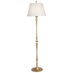 a gold floor lamp with a white shade on the base and a light bulb in the middle