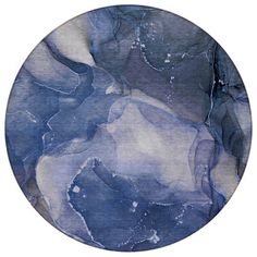 an abstract blue and white painting on a plate