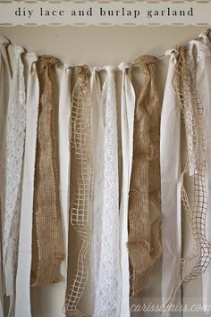 some white lace and burlap garlands hanging from a wall with the words wrap me in burlap