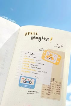 an open notebook with stickers on it