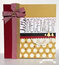 a handmade christmas card with a red ribbon