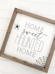 a sign that says home sweet, haunted home