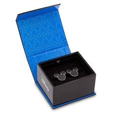 Step out in style with Mickey and our set of shimmering silvertone cloisonne cufflinks showcasing the iconic mouse head icon in basic black enamel. Mickey Mouse Icon, Mouse Icon, Head Silhouette, New Mickey Mouse, Disney Characters Videos, Disney Sketches, Disney Jewelry, Disney Stuff, Spinning Wheel