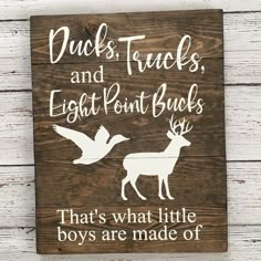 a wooden sign that says ducks, trucks and eight point bucks that's what little boys are made of