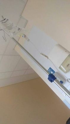 a hospital room with medical equipment hanging from the ceiling