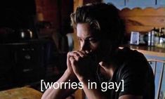 a man sitting at a table with his hand on his chin and the words'worries in gay'above him