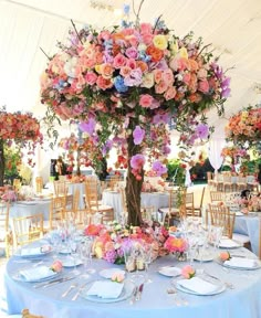 an instagram photo of a table with flowers and place settings on the table top