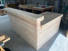 a large wooden box sitting in the middle of a garage