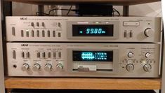 an old stereo system sitting on top of a wooden shelf