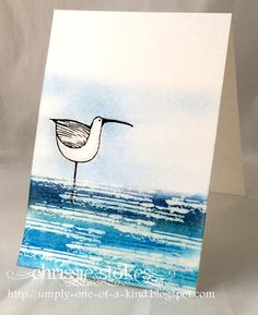 a card with an image of a bird on the beach