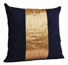 a black and gold pillow with sequins on the side, sitting against a white background