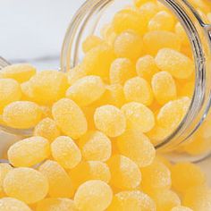 small yellow candies in a glass jar