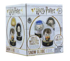 two harry potter snow globes are in the box with instructions on how to make them