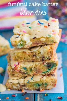 three pieces of cake batter blondies stacked on top of each other with sprinkles