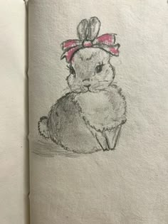 a drawing of a bunny with a bow on its head