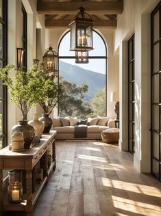 a living room filled with furniture and lots of windows