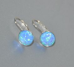 "Shop Leverback Earrings, Blue Opal Earrings Sterling Silver, Opal Jewelry Looking for opal jewelry? Opal is October birthstone. Shop Lever Back Earrings, Opal Earrings Sterling Silver, October Birthstone, 8mm Stone, Beaded Bridal Opal Jewelry. Opal earrings will bring a perfect touch of flair and splash of magnificent color to your outfit! Arrays of different colors are captured in beautiful opal cabochons. They look very mysterious. Lever back earrings are very light and comfortable. It will m Formal Opal Round Earrings, Formal Round Opal Earrings, Opal Jewelry With Matching Earrings For Anniversary, Anniversary Opal Jewelry With Matching Earrings, Elegant Adjustable Opal Earrings, Hypoallergenic Opal Round Earrings, Silver Opal Earrings For Wedding, Opal Ear Wire Earrings For Gift, Opal Earrings With Ear Wire For Gift