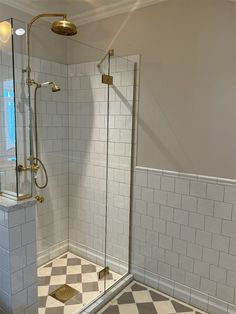 a walk in shower sitting inside of a bathroom