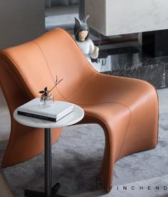 a chair with a book on top of it next to a table