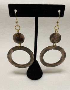 These are beautiful brown statement earrings. They are neutral but not boring and come with gold nickel free fishhook backings that are hypoallergenic. The resin is colored with two shades of brown so they have a marbled effect in the sunlight making them great for day and night wear. They are lightweight as they are made with resin and colored with mica pigment so they have a slight shimmer as well. Earthy Brown Drop Earrings, Earthy Brown Copper Earrings, Brown Brass Dangle Earrings, Brown Brass Drop Earrings, Brown Brass Hoop Earrings As Gift, Gift Brown Brass Hoop Earrings, Earthy Brown Earrings With Ear Wire, Everyday Brown Metal Jewelry, Everyday Hypoallergenic Brown Jewelry