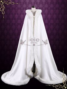 Floor length wedding cloak made with satin and faux fur edge. Length approx 76 in length from shoulder to train Photoed in ivory, but can be made in another color or length of your choice ieie Bride Shaena Targaryen, Cloak With Fur, Victorian Dress Aesthetic, Fantasy Cape, Wedding Gown Alterations, Medieval Dresses, Winter Costume, Wedding Cloak, Queen Outfits