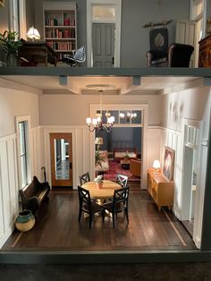 an overhead view of a living room and dining room in a doll's house