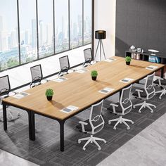 an empty conference table with chairs and plants on it in front of a large window