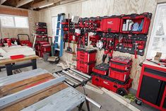 a room filled with lots of red tool boxes