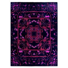 a purple and red rug with an intricate design