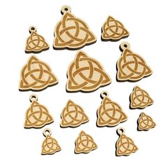 wooden charms in the shape of triangles with knots on each side and an arrow at the end