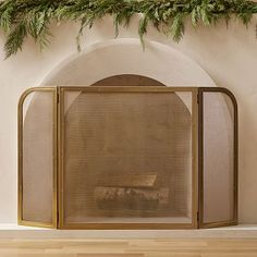 an old fireplace screen with the words west elm on it