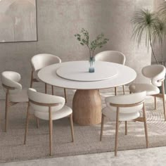 a white table with six chairs and a vase on the top is surrounded by plants