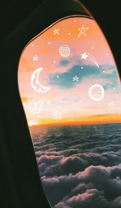 the view out an airplane window shows planets and stars in the sky above the clouds