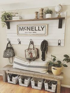 a bench with some baskets on top of it and a sign that says menlly above it