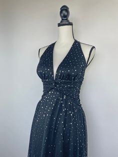 Jump Apparel black halter neck dress with ruching under the bust and silver reflective painted sequins. Measurements Size 5/6 (Fits like a small/medium 6/8) Materials 100% polyester Please message me regarding any sizing questions or concerns. ☻ Follow along for previews on new styles coming in and styling tips on Instagram @maryiaandco✨ Black Halter Neck Dress For Gala, Black Fitted Halter Dress For Party, Fitted Black Halter Dress For Party, Glamorous Black Halter Dress For Evening, Black Ruched Halter Neck Dress, Black Fitted Halter Dress For Evening, Halter Vintage Dress, Black Halter Neck Dress, Vintage Halter Dress