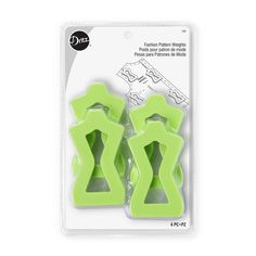 two green plastic cutters in packaging on a white background, one is shaped like an x