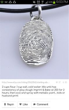 a necklace with a fingerprint on it is shown in the middle of an instagram page