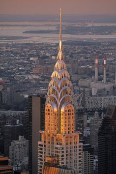 an aerial view of the chrysler building in new york city, ny at sunset or dawn